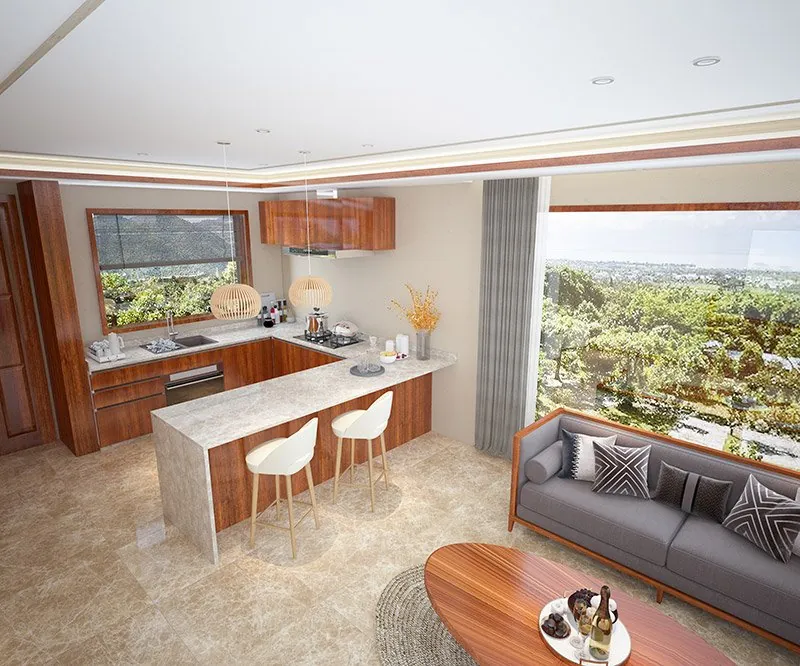 Open-plan lodge lounge with a grey sofa, breakfast bar and wide windows onto the landscape